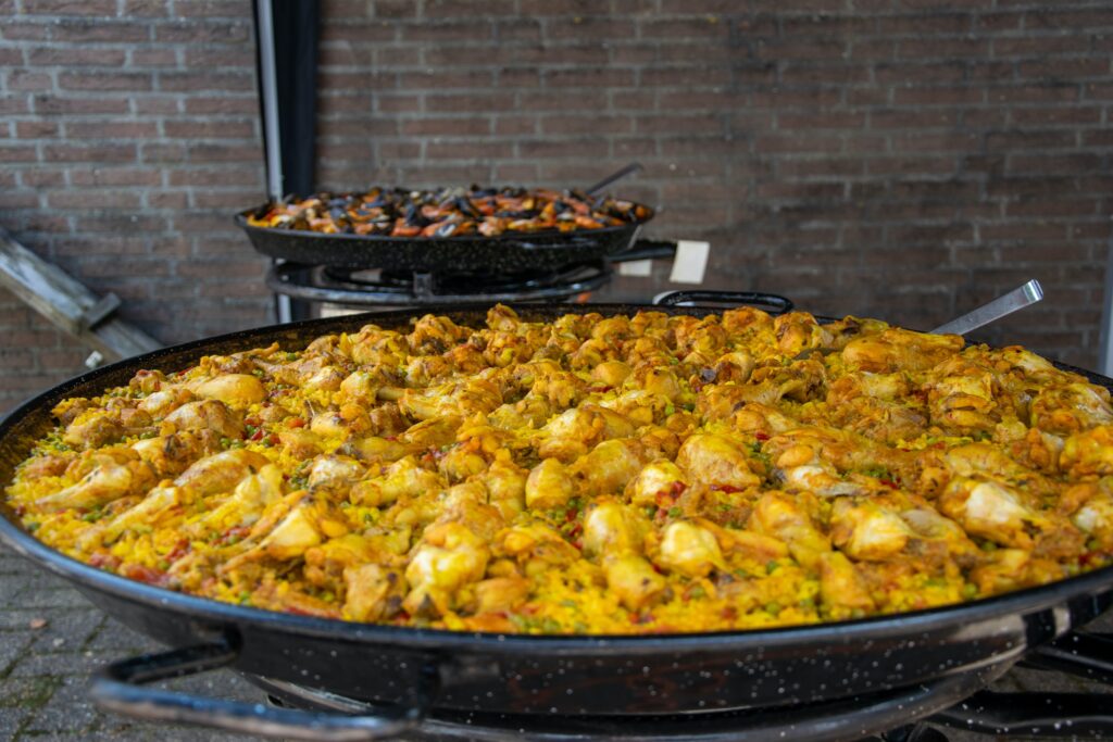 a large pan of food sitting on top of a stove